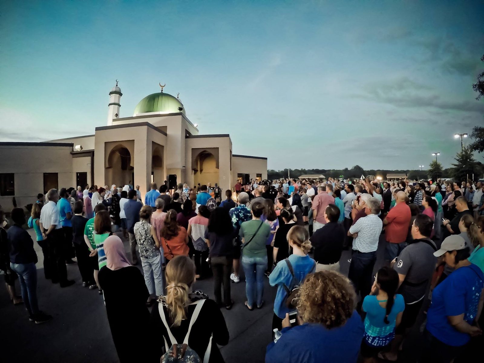 A large crowd of Murfreesboro residents gathered in front of ICM at dusk in a show of solidarity after the 2017 vandalism